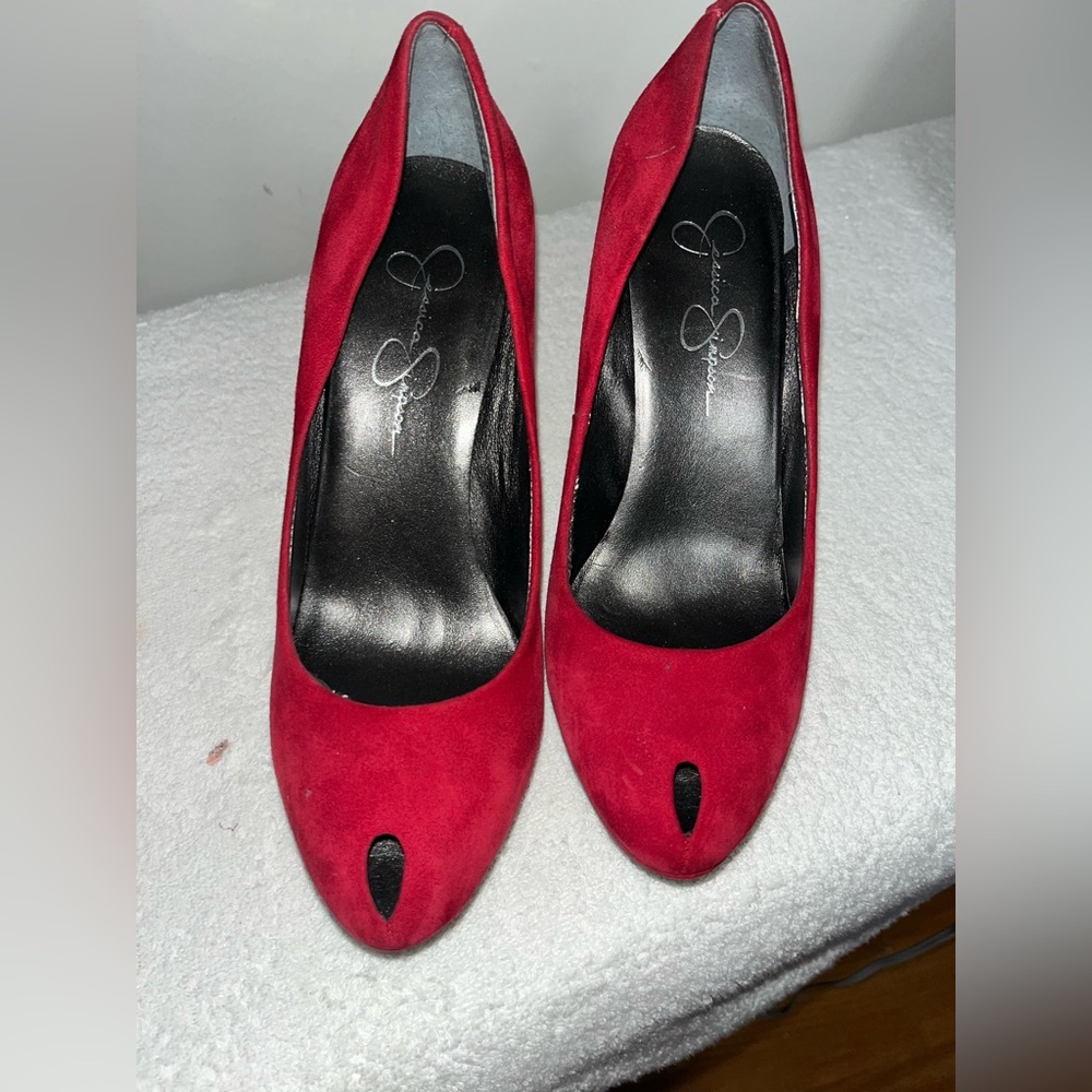 Worn  red peep toe red suede Jessica Simpsons heels.